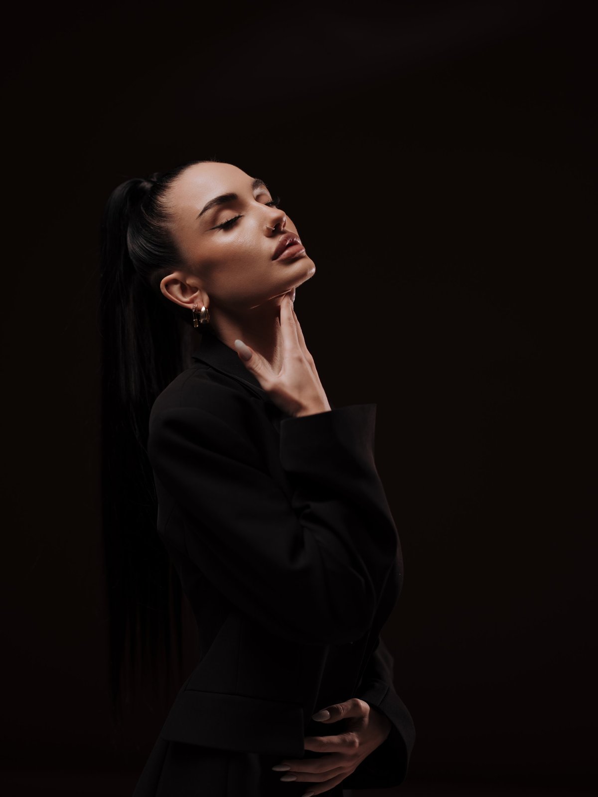 Woman in a black blazer, editorial portrait